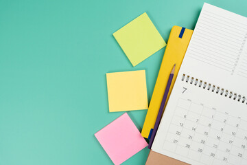 close up of calendar on the colorful table background, planning for business meeting or travel planning concept