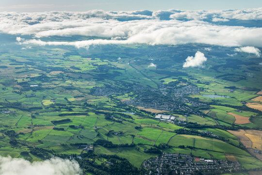 Aerial view of the city of Bridge of Veir surrounded by green fields in the scottish countryside near Glasgow, Central Lowlands of Scotland, UK