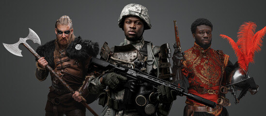 Shot of black soldier with camouflage uniform and viking with spanish conquistador.