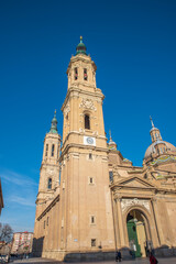 del Pilar basilica, one of the important architectural symbols of zaragoza, and the Ebro river and its reflection with sunset colors and clouds