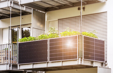 Solar Panel in Modern Balcony of Apartment Building with Sun light Reflection. Solar Energy of  Apartments Flat. Eco Apartment in Eco City.