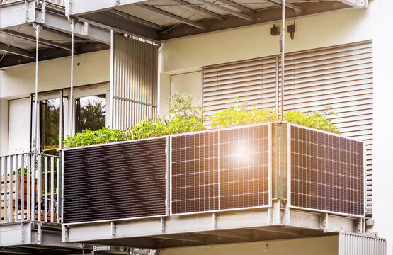 Solar Panel In Modern Balcony Of Apartment Building With Sun Light Reflection. Solar Energy Of  Apartments Flat. Eco Apartment In Eco City.