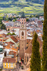 View over cityscape with Cathedral Saint Nikolaus of Merano, South tyrol, Italy seen from famous hiking trail Tappeinerweg