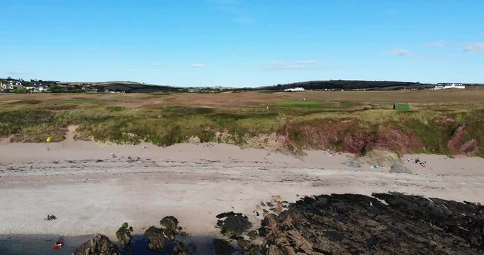 Aerial View Of Empty Beach At Thurlestone With Low Tide. Dolly Back Ascending Shot