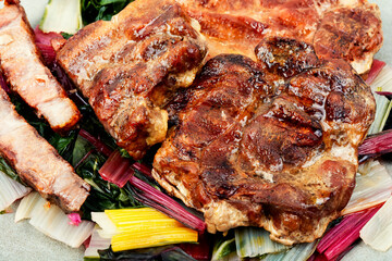 Tasty meat steak with green salad.