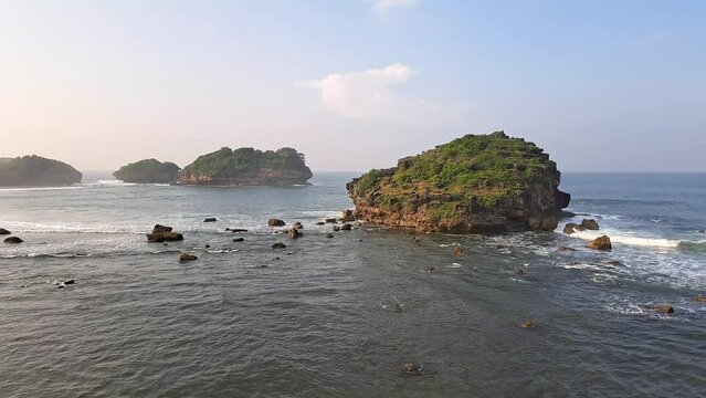 Watu Karung Beach, Pacitan, East Java, Indonesia. A beach with friendly waves for surfers.