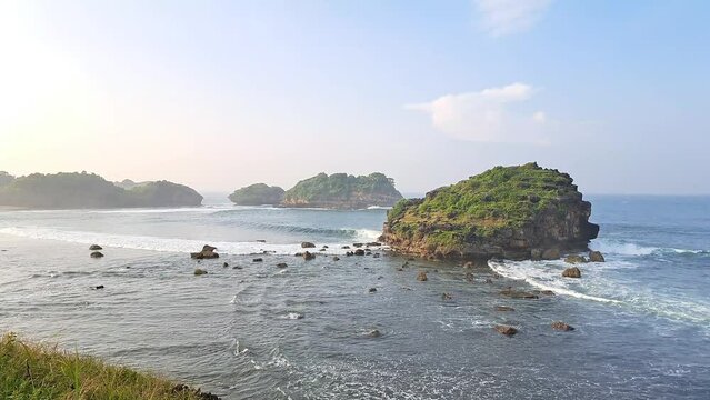 Watu Karung Beach, Pacitan, East Java, Indonesia. A beach with friendly waves for surfers.