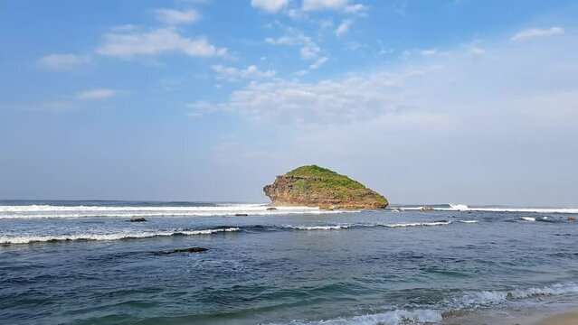 Watu Karung Beach is located in Pacitan, East Java, Indonesia. A beach with friendly waves for surfers.