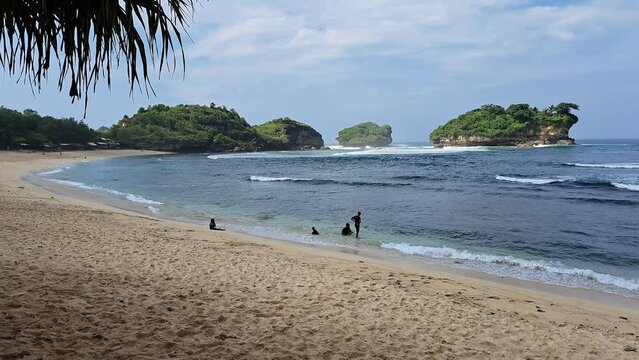 Watu Karung Beach, Pacitan, East Java, Indonesia. A beach with friendly waves for surfers.