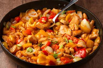 Sweet and sour chicken with colorful bell pepper on a plate. Chinese Asian style Food dish