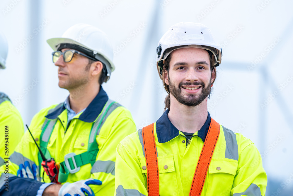 Aufkleber engineer working and maintenance in wind turbine,power generation saving and using renewable energy 
