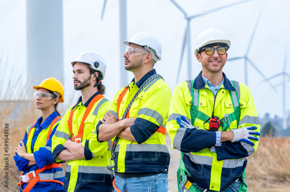 Poster Engineer inspecting a wind turbine,Wind turbines are an alternative electricity source to be sustainable resources in the future.