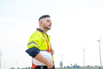 Wind turbine engineer,Engineer maintains and controls wind turbine energy generation on wind turbine farm,Concept of sustainable future.