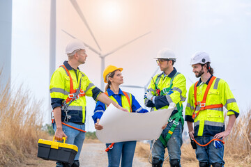 Electrical engineer checking on wind turbine energy production,Concept of alternative energy and service.