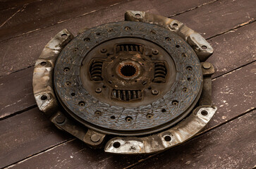 Disassembled clutch disc of a car in a car service repair shop