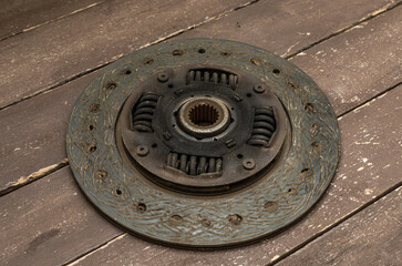 Disassembled clutch disc of a car in a car service repair shop