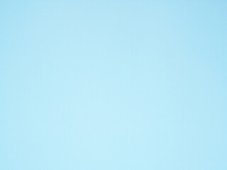 Empty light blue colored background texture. Blank blue paper surface space for your image, text, art, design, and composition for banner, wallpaper, backdrop.