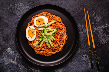 Korean traditional food, cucumber and boiled egg cold spicy noodles.