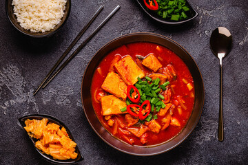 Korean traditional food, spicy kimchi soup (kimchi tige) with pork and tofu cheese.