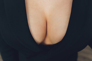 neckline, beautiful large female breast, dress, close-up.