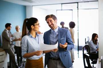 Group of successful business people meeting in office, sharing their ideas.