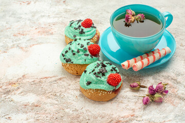 front view cup of tea with creamy cakes on white background tea dessert biscuit cake pie