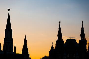 Fototapeta na wymiar Silhouettes of towers near Moscow Kremlin on sunset
