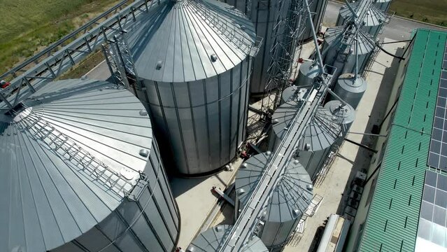 Large grain silos tanks for agriculture harvest crops, aerial shot