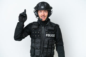 SWAT man over isolated white background intending to realizes the solution while lifting a finger up