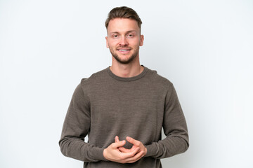 Young blonde caucasian man isolated on white background laughing