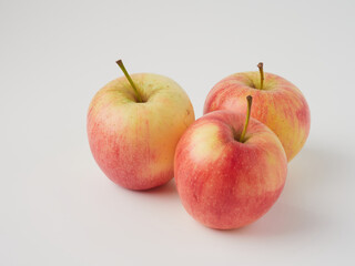 A red apple isolated on a white background with a cropped outline and full depth of field