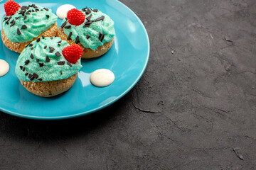 front view little creamy cakes delicious sweets for tea inside plate on dark background tea cream cake biscuit dessert color