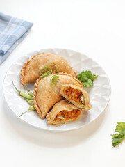 fried pastels atau pastel goreng are a kind of pastry made by placing the stuffing on top of the dough, then folded and tightly closed. Pastels can taste sweet or savory