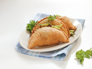 fried pastels atau pastel goreng are a kind of pastry made by placing the stuffing on top of the dough, then folded and tightly closed. Pastels can taste sweet or savory
