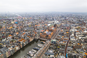 Fototapeta premium Amsterdam Center tightly woven network of canals and overlapping micro-neighborhoods each bursting with their own unique vibe and history. High quality photo