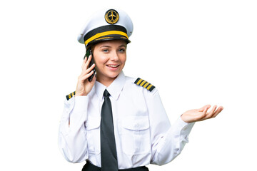 Airplane pilot woman over isolated chroma key background keeping a conversation with the mobile phone with someone