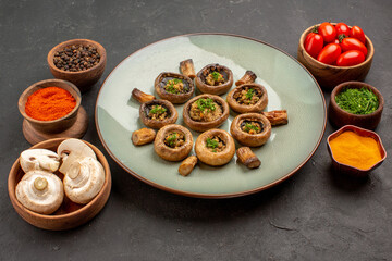 front view tasty mushrooms dish with tomatoes and seasonings on dark background dish meal cooking mushroom dinner