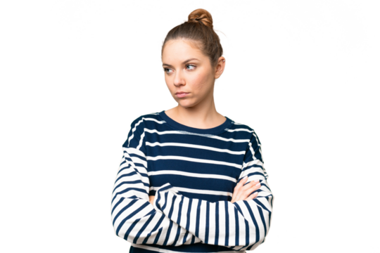 Young blonde woman over isolated chroma key background keeping the arms crossed