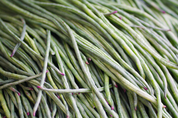 pile of long beans in a traditional market in Indonesia