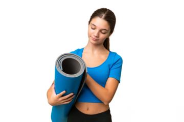 Teenager caucasian girl going to yoga classes while holding a mat over isolated background with sad expression