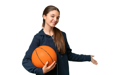 Teenager caucasian girl playing basketball over isolated background extending hands to the side for inviting to come