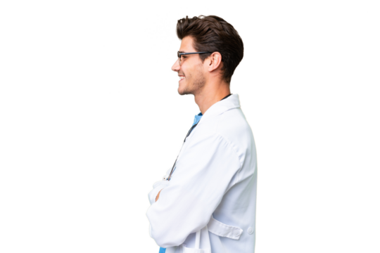 Young doctor man over isolated background in lateral position