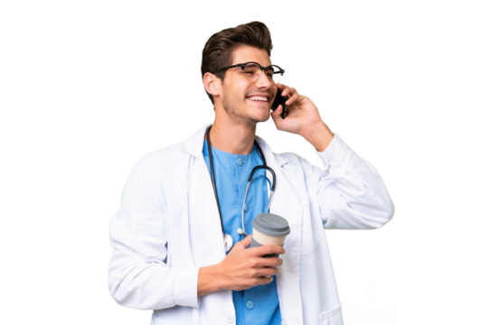 Young doctor man over isolated background holding coffee to take away and a mobile - Powered by Adobe