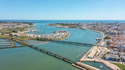 Portuguese bridges over the river Arade overlooking the city of Portimao. Ponte Velha old bridge. 