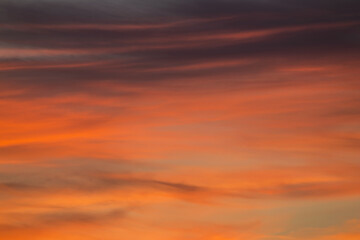 Beautiful clouds in the sunset light. Abstract composition of dramatic sky.