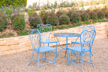 Blue table and chairs in the garden 