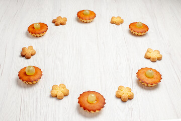 front view yummy little cakes lined with cookies on white background dessert biscuit tea cake pie sweet cookies