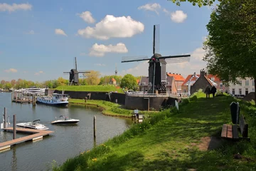 Papier Peint photo Europe du nord The Harbor of Heusden, North Brabant, Netherlands, a fortified city located 19km far from Hertogenbosch, with windmills and mooring boats