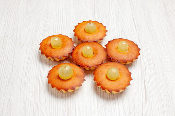 front view yummy little cakes perfect sweets for tea lined on white desk cake pie sweet dessert tea cookie