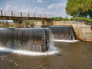Water cascades over water level control weirs - part of the tank cascade system in central Sri...